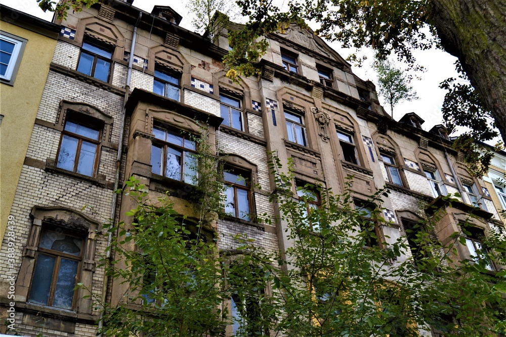 Old Karl Marx Stadt  new city of  Chemnitz. Ancient building in Chemnitz with trees and overcast sky during autumn