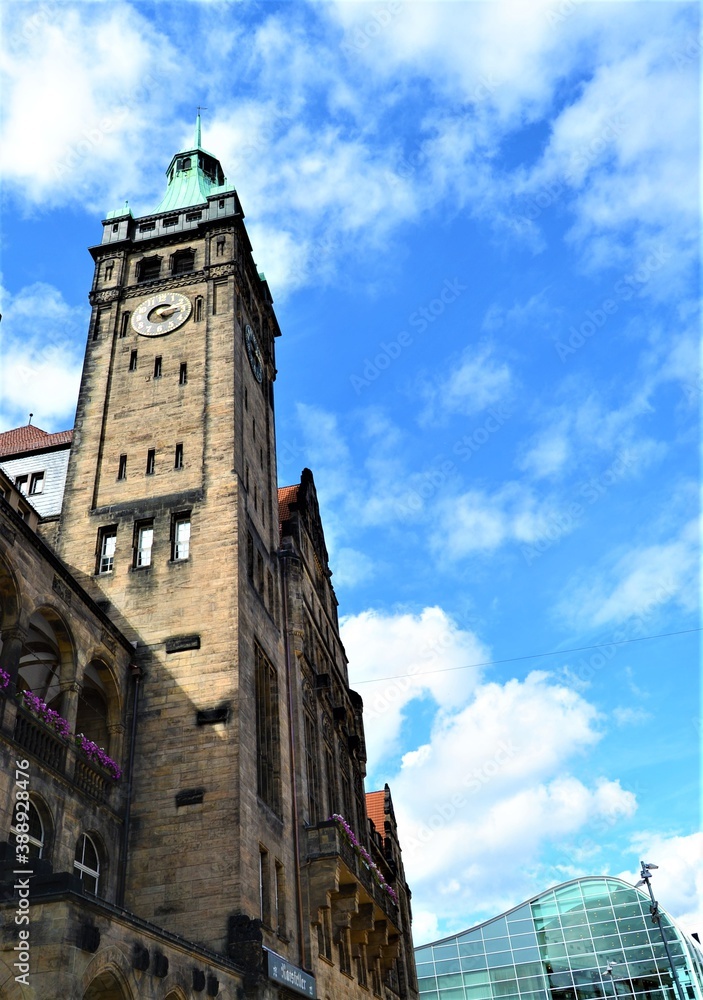 Chemnitz city center during sunny day. Chemnitz town-hall building and clock tower with blue sky and white cloud.
