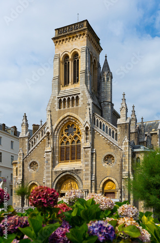 Summer landscape of Biarritz overlooking one of major city landmarks - neo-gothic Sainte Eugenie church, France..