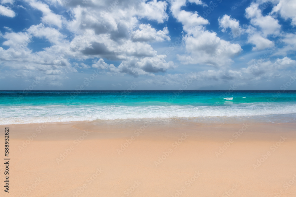 Tropical paradise beach with warm sand and turquoise sea in paradise island. Tropical beach background.
