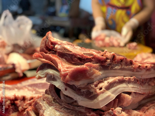 Streaky pork, Pieces of pork meat for sale in local night market. Eating large amounts of pork belly and eating it frequently carries a high risk of cholesterol and saturated fat.