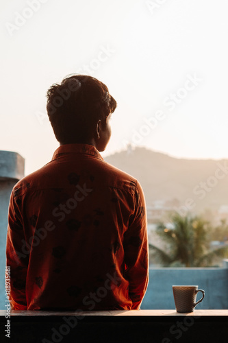 Indian kid standing besides the tea cup during morning © Shiv Mer