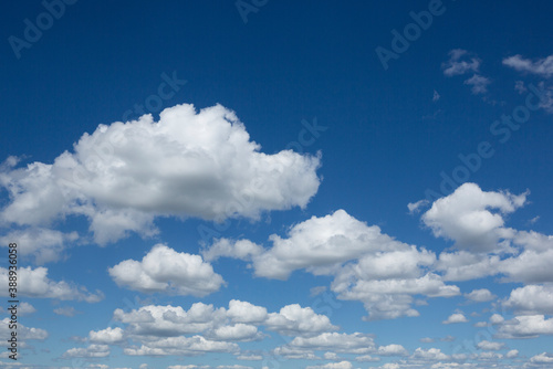 Fluffy White Cumulus Clouds against Blue Sky for Background