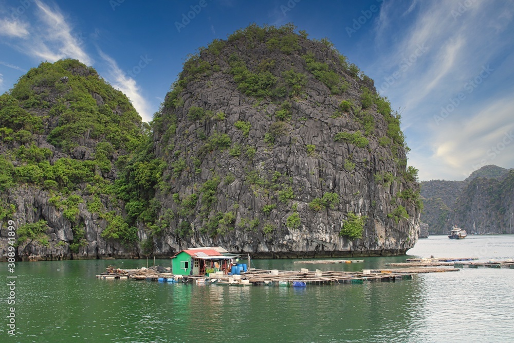 A floating fishing village in between the thousand islands of Halong Bay in Vietnam