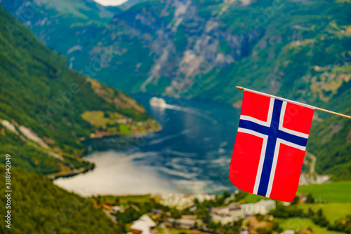 Norwegian flag and Geiranger fjord landscape