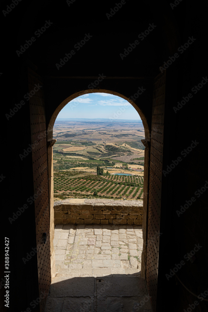 views of the mountainous landscape from inside the dark medieval castle. through the front door. receiver