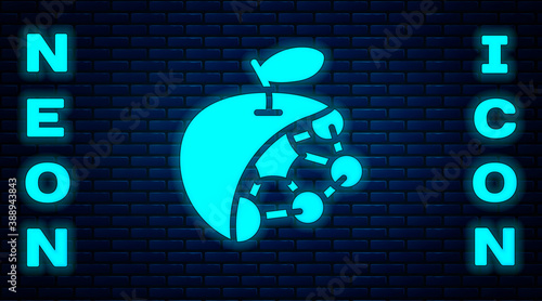 Glowing neon Biological structure icon isolated on brick wall background. Genetically modified organism and food. Vector.