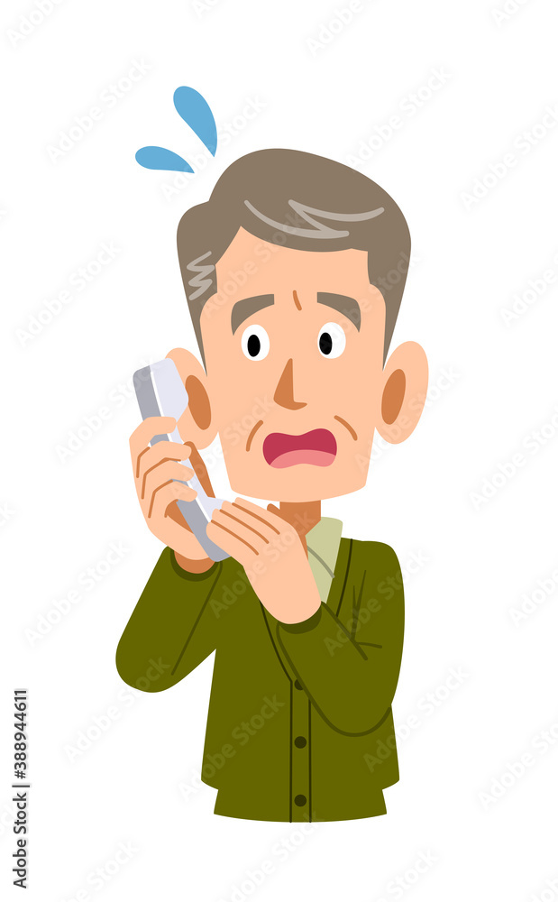 電話の応対に焦るシニアの男性
