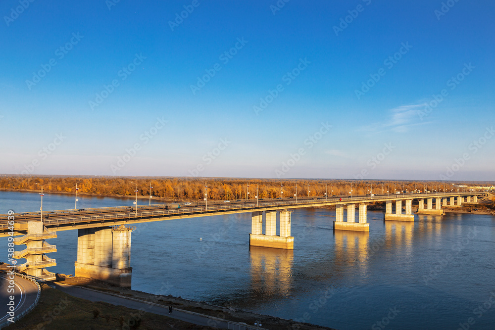 Automobile bridge over the Ob river in Barnaul on a sunny autumn day. Altai Krai, Russia