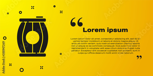 Black Gun powder barrel icon isolated on yellow background. TNT dynamite wooden old barrel. Vector.