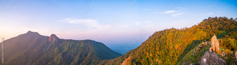 Beautiful sunrise over the mountain range and sea clouds