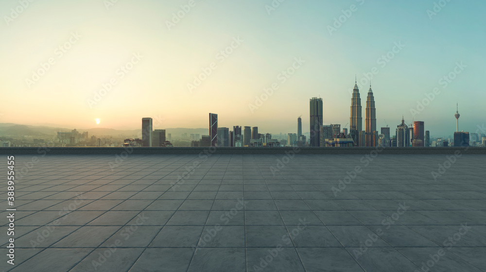 Empty concrete tiles floor with city skyline background