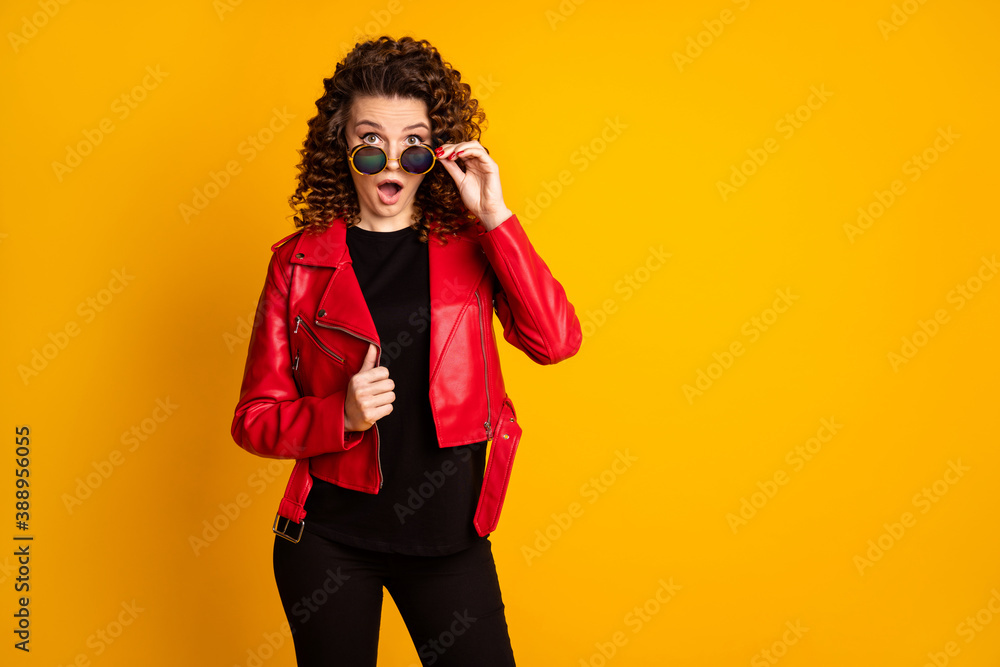 Portrait of her she nice attractive amazed wavy-haired girl touching specs reaction isolated on bright yellow color background Portrait of her she nice attractive amazed wavy-haired girl touching specs reaction isolated on bright yellow color background