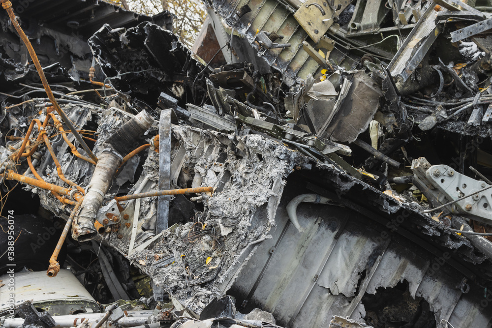 Plane wreckage, parts of the fuselage of a burned and broken aircraft