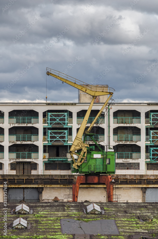 Fototapeta premium HARBOR CRANE - Sea port devices and warehouses