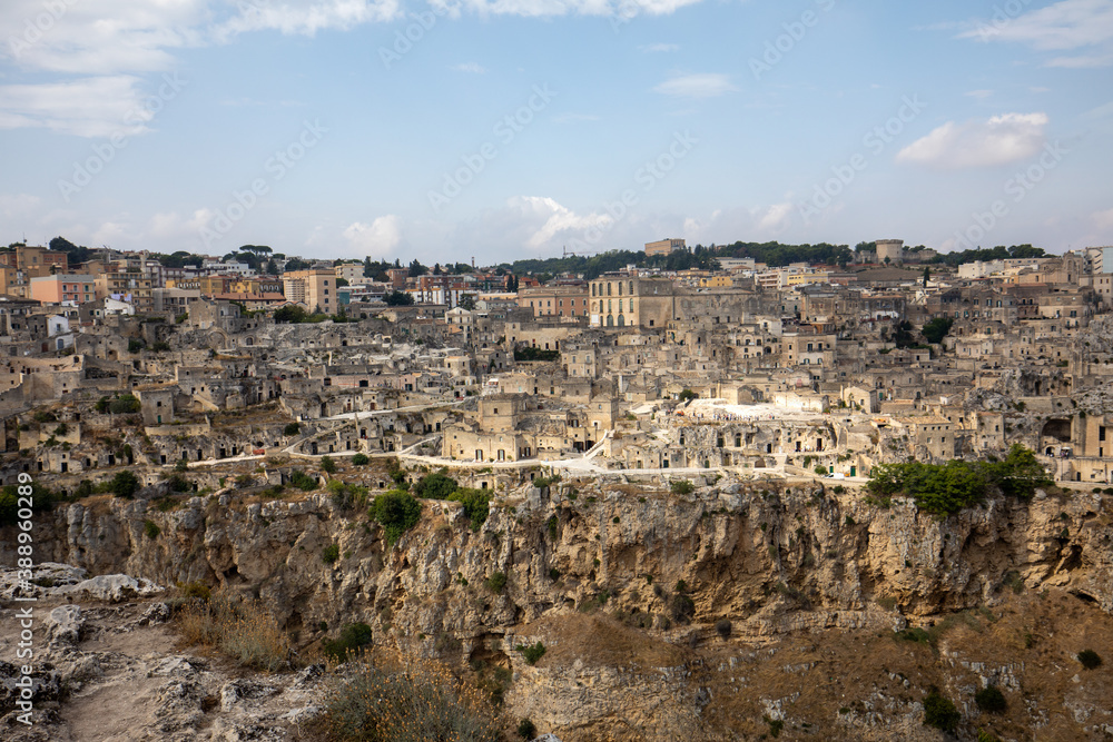 Panoramic view of Sassi di Matera a historic district in the city of Matera, well-known for their ancient cave dwellings from the Belvedere di Murgia Timone,  Basilicata, Italy