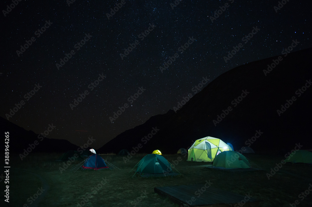 tent camp at night in the mountains