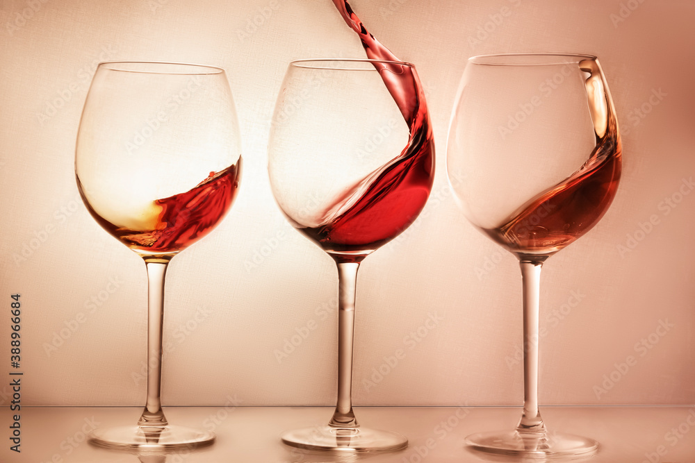 splashes wine at bright beige background splashes wine at bright beige background