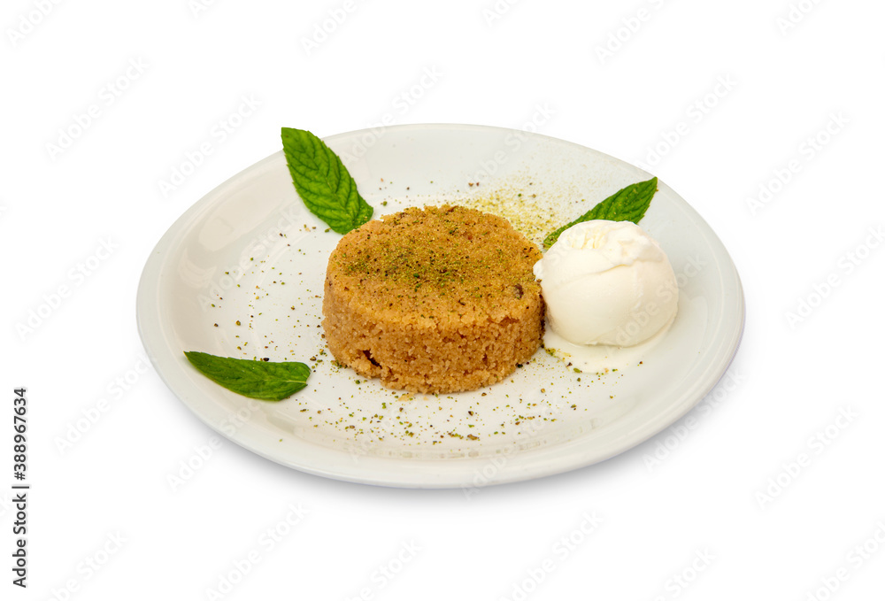 Semolina dessert and ice cream in white plate, standing on isolated background. Semolina dessert and ice cream in white plate, standing on isolated background.
