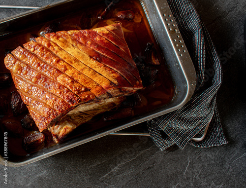 roast pork belly on a baking sheet  photo