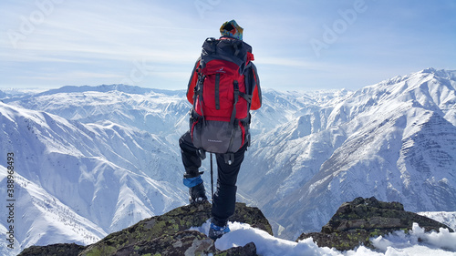 A skier, winter season, enjoying skiing, cold weather, white landscape 