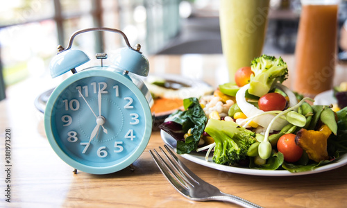 Bild auf Leinwand Selective focus with Blue clock breakfast time and Intermittent fasting ,Lifestyle concept