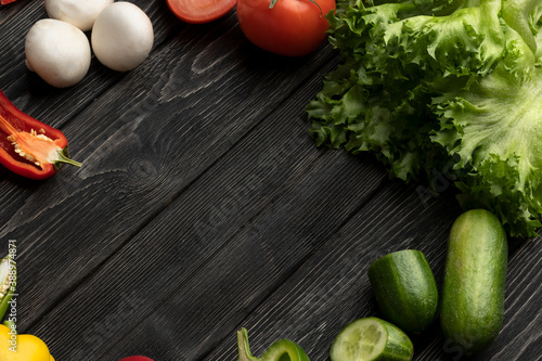 Healthy food. Vegetables on a black wooden background. Top view. Copy space. 