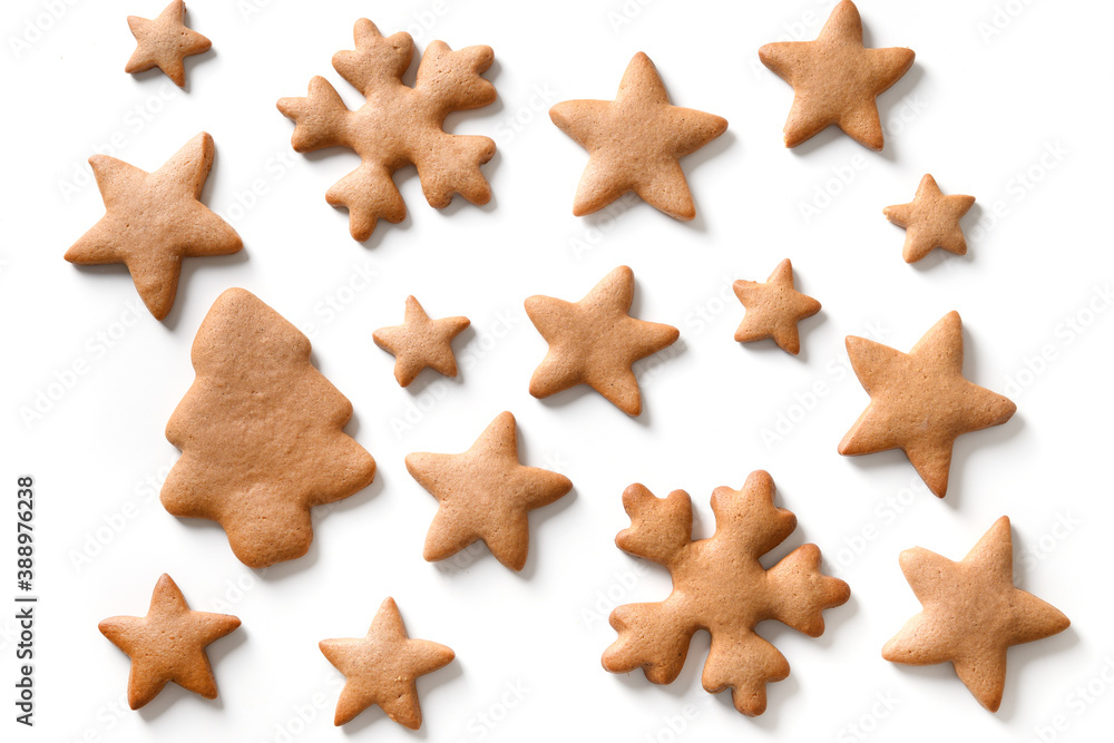 Pattern of different Christmas homemade gingerbread cookies as snowflakes, stars, christmas tree on white background. Xmas abstract background. Pattern of different Christmas homemade gingerbread cookies as snowflakes, stars, christmas tree on white background. Xmas abstract background.