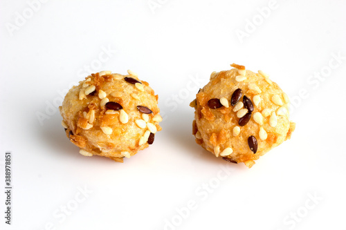 large baked rice balls with sesame seeds and seeds
