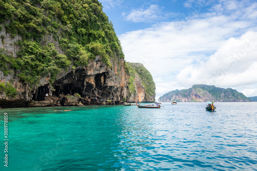 Landscape of Viking cave with longtail boat for traveler, Maya bay, Phi Phi island, Andaman sea, Krabi, near Phuket, Travel Thailand