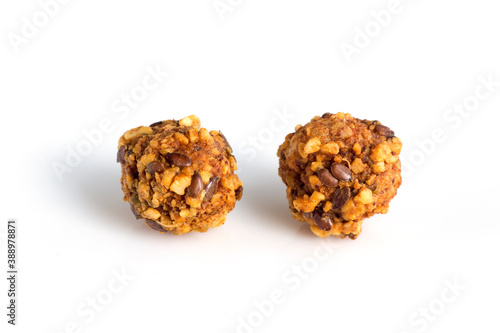 large baked rice balls with sesame seeds and peanut nuts