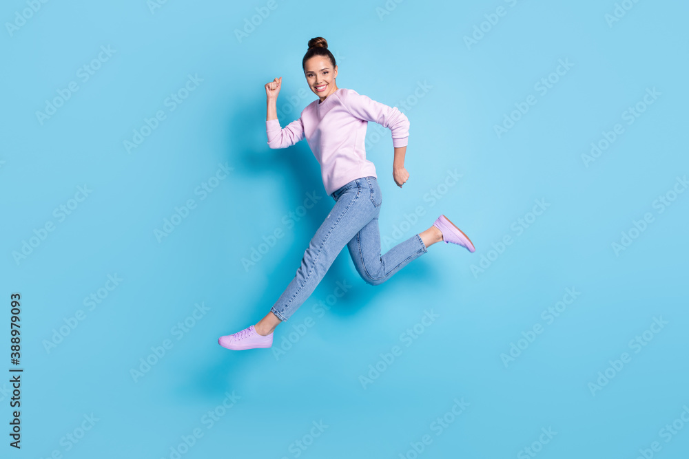 Full length body size profile side view of her she nice attractive pretty cheerful cheery girl jumping running healthy life isolated bright vivid shine vibrant blue color background Full length body size profile side view of her she nice attractive pretty cheerful cheery girl jumping running healthy life isolated bright vivid shine vibrant blue color background