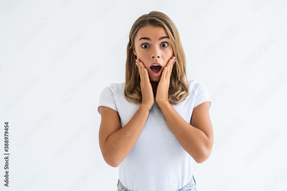 Amazed woman shocked looked isolated on a white background Amazed woman shocked looked isolated on a white background