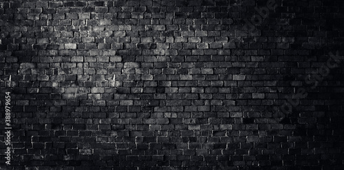 Rustic black brick wall grunge texture background.