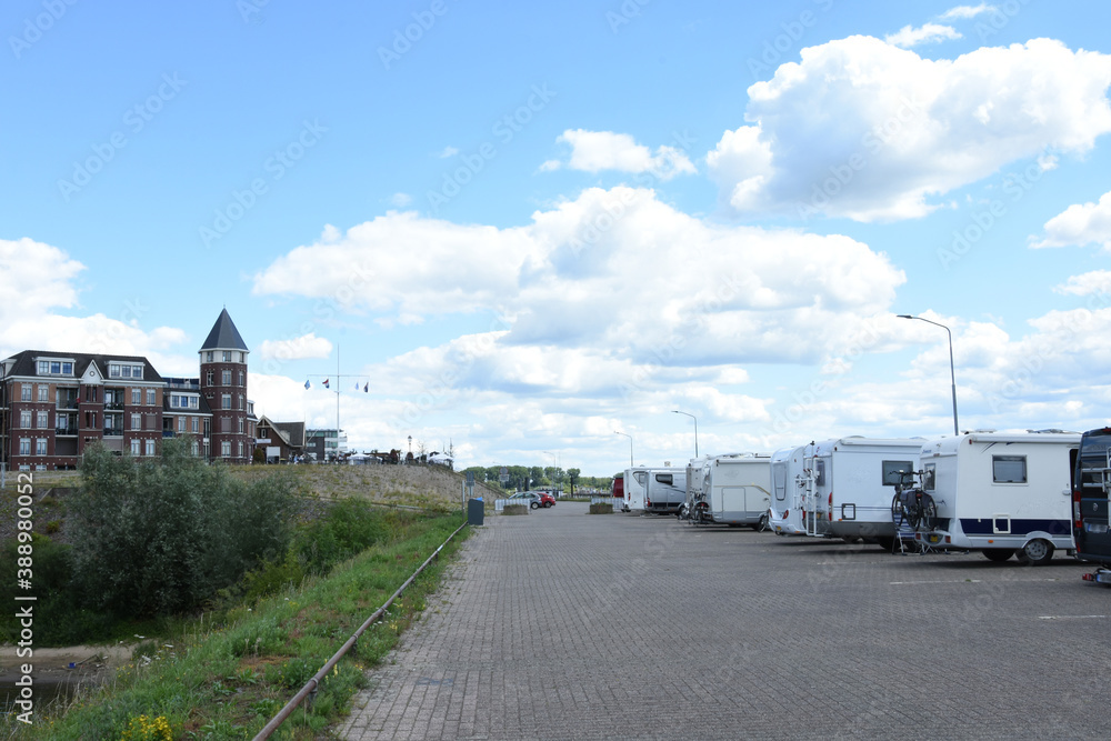 campers on quay near river Rhine