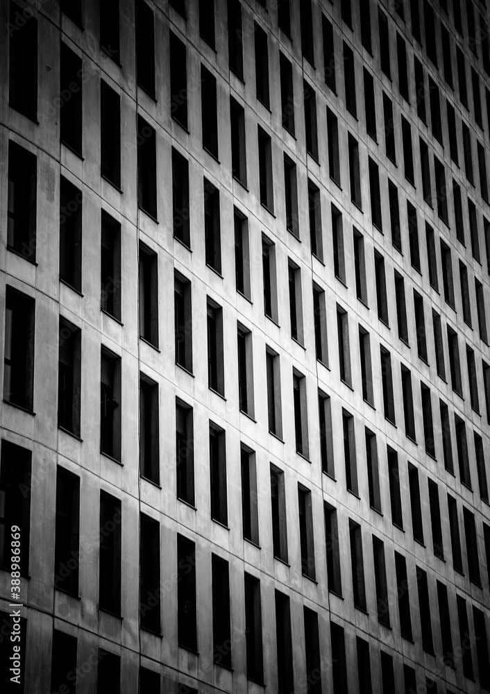 Building with windows forming a pattern in black and white. Abstract lines Building with windows forming a pattern in black and white. Abstract lines