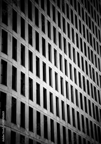 Building with windows forming a pattern in black and white. Abstract lines