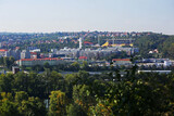 Prague. View of the urban districts Bubenec, Dejvice and the Juliska stadium from the zoo in Troy. Green trees in the foreground.