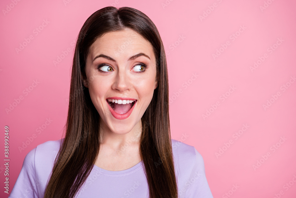 Closeup photo of attractive funny lady good mood smiling teeth long hairdo open mouth look side empty space tricky person wear casual violet t-shirt isolated pink pastel color background Closeup photo of attractive funny lady good mood smiling teeth long hairdo open mouth look side empty space tricky person wear casual violet t-shirt isolated pink pastel color background