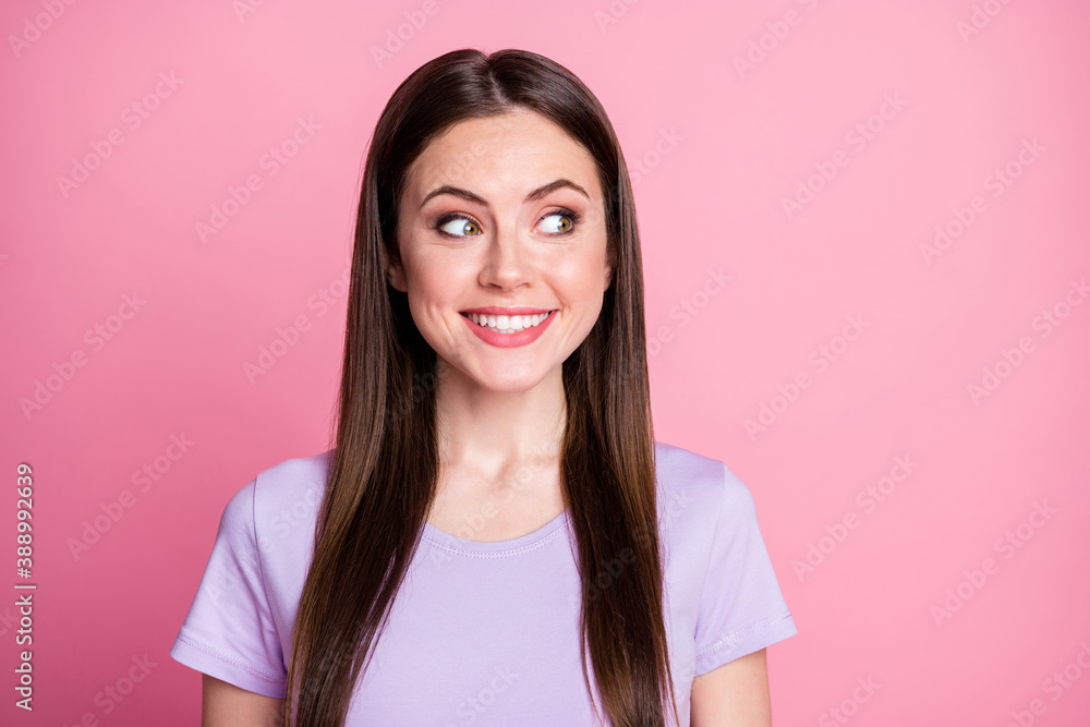 Closeup photo of attractive funny lady good mood smiling demonstrate white teeth excited crazy face look side empty space wear casual violet t-shirt isolated pink pastel color background Closeup photo of attractive funny lady good mood smiling demonstrate white teeth excited crazy face look side empty space wear casual violet t-shirt isolated pink pastel color background