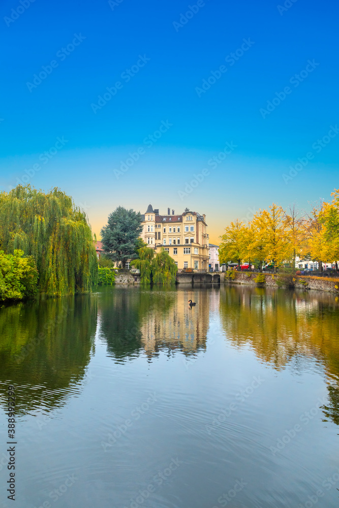 detmold castle with canal and water reflection
