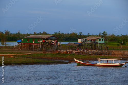 Tropical Amazon landscape shortly before sunset, idyllic villages of small farmers and fishermen on the banks of the Amazon River near Curuari Óbidos, Paraná do Amador, state of Pará, Brazil