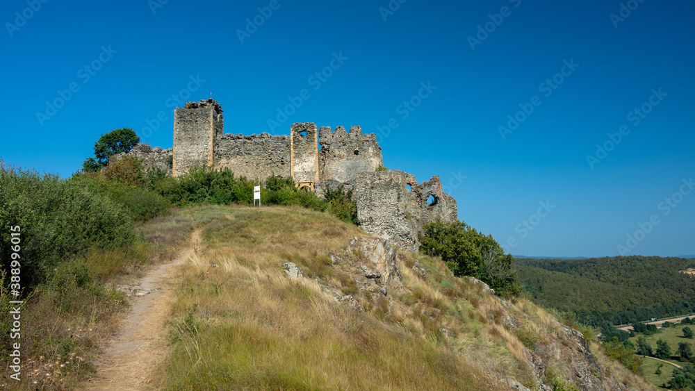 Soimos Fortress standing on a hilltop in a sunny summer day. Romania