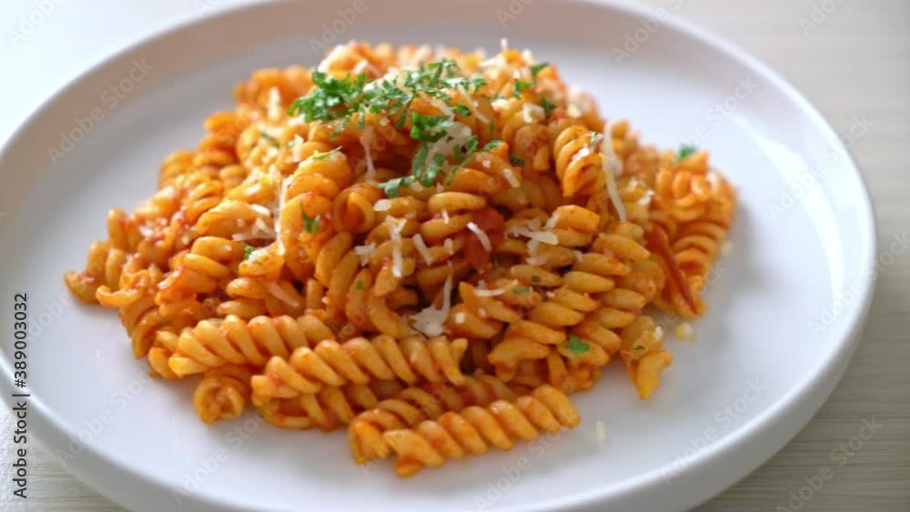 spiral or spirali pasta with tomato sauce and cheese - Italian food ...