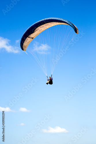 Paraglider flying above Mediterranean in Arsuf, Israel