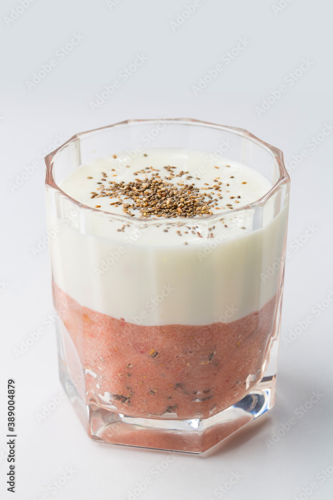 Layer of strawberry and banana smoothie and white yoghurt Layer of strawberry and banana smoothie and white yoghurt