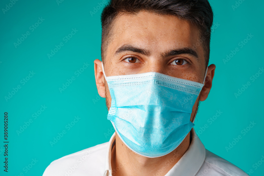 Handsome mixed-race man wearing medical face mask