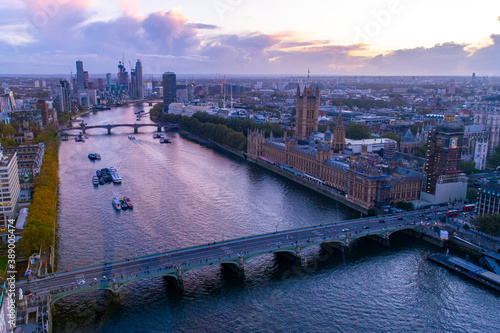 London city river Thames, houses of parliament and big ben viewed from London eye near Westminster bridge at dusk sunset