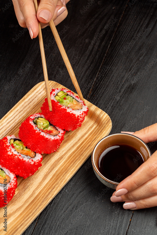 California rolls, covered by red caviar California rolls, covered by red caviar