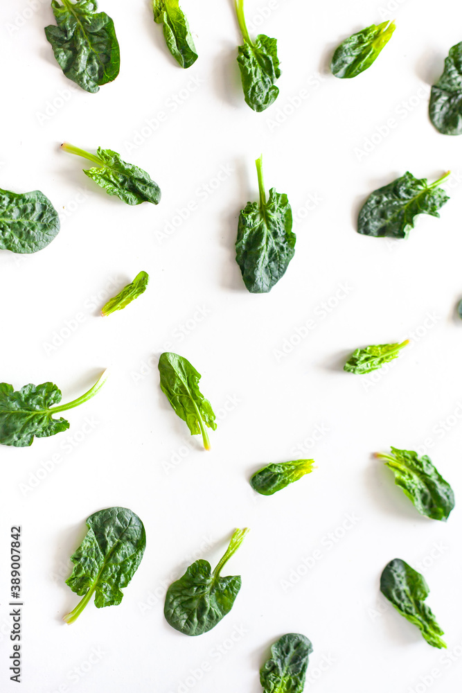 Fresh spinach bundle isolated on white top view. Vegetable banner or heading design. Fresh spinach bundle isolated on white top view. Vegetable banner or heading design.